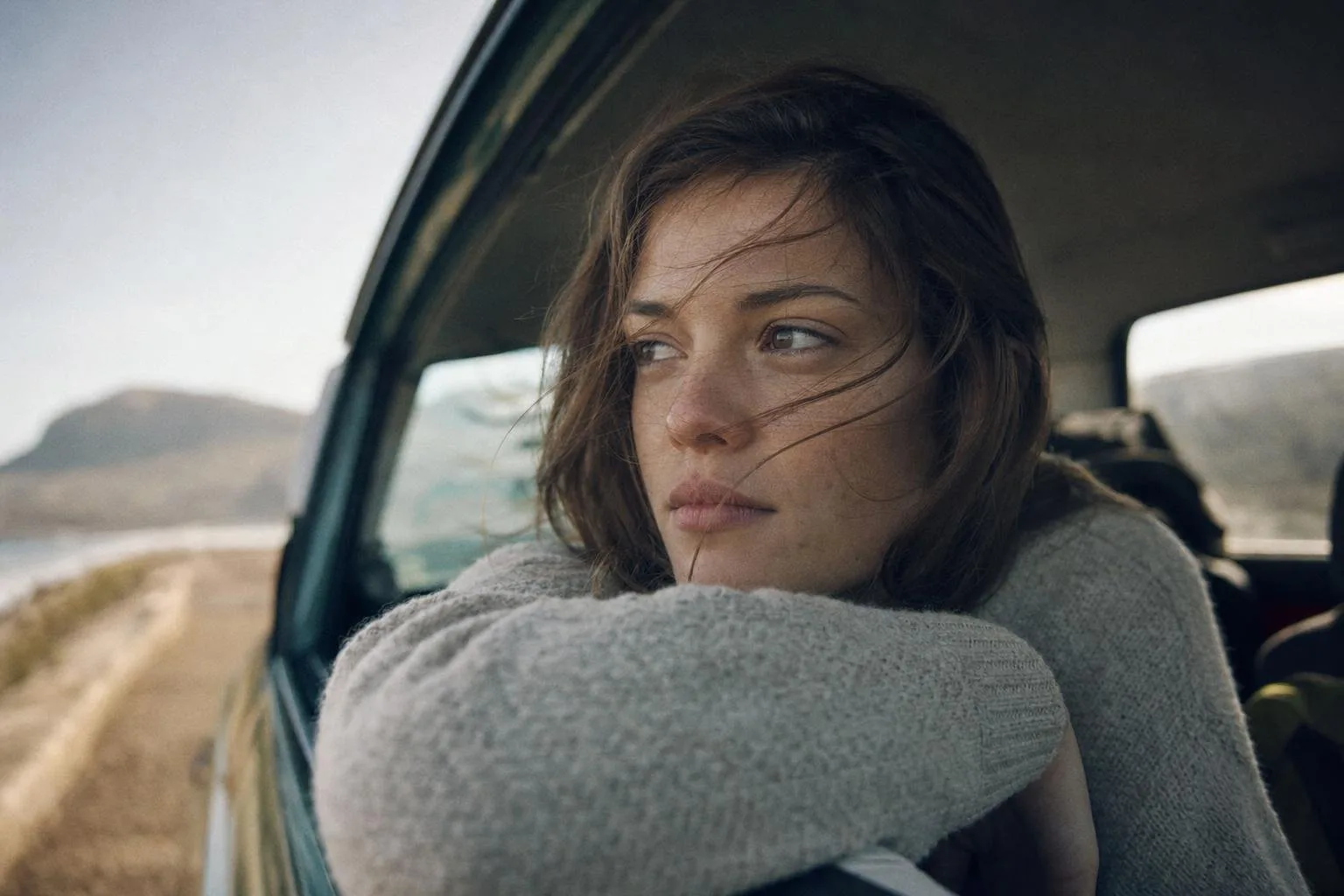 Editing suite with film stills across a wide color-grading monitor